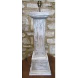 A panted pedestal lamp base of square cut form, 67cm high