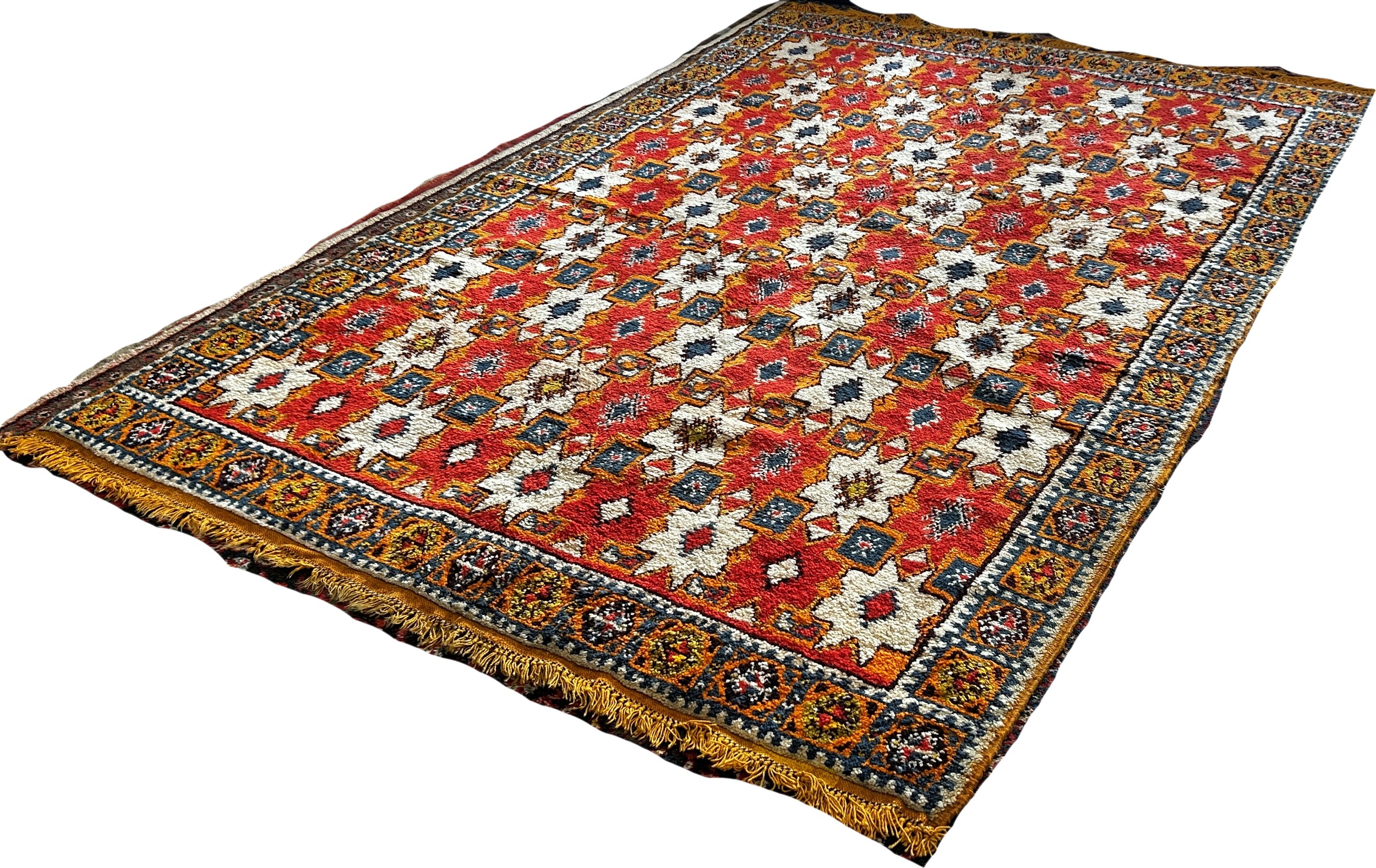 A Moroccan wool carpet with cream stars on a predominantly orange ground, 280 x 190cm approximately. - Image 2 of 3