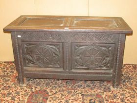 Early 18th century oak panelled coffer with carved finish, 105cm wide