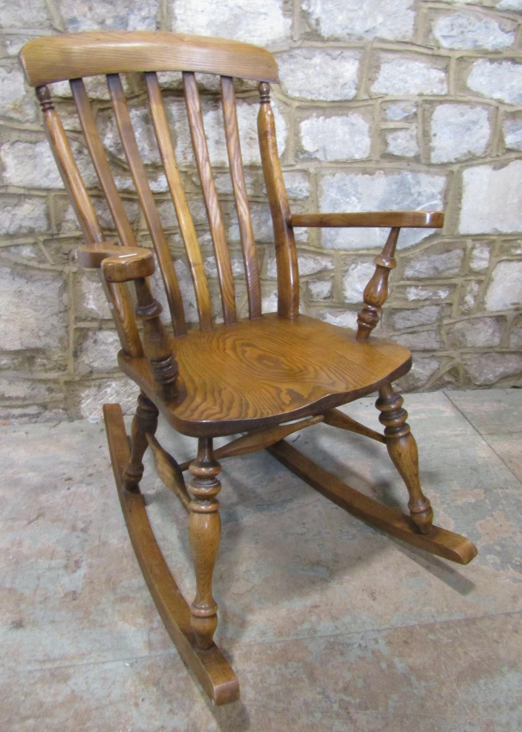 A Windsor lathe back rocking chair, principally in ashwood