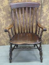A Windsor lathe back chair with wide body and elm seat