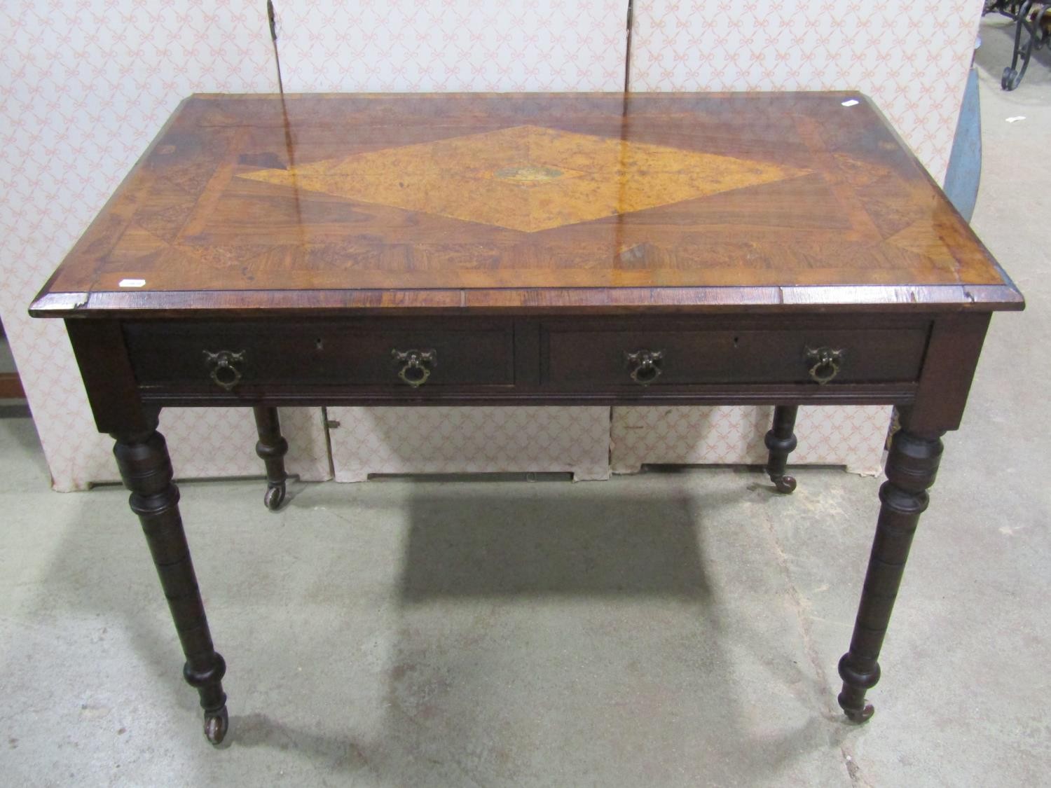 Victorian side table, the top in mixed wood with geometric detail, to the centre Britannia with