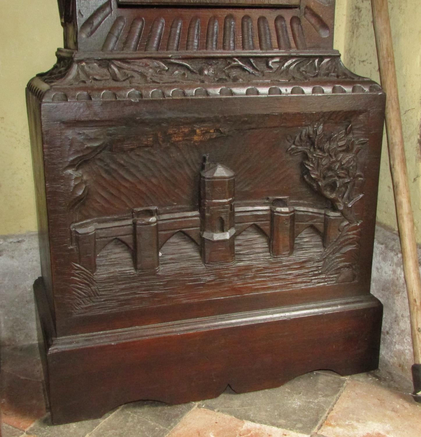 A 19th century oak longcase clock with heavy estate carving, the trunk detailing a knight fighting - Image 11 of 17