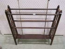 An Edwardian walnut clothes horse of tapering form
