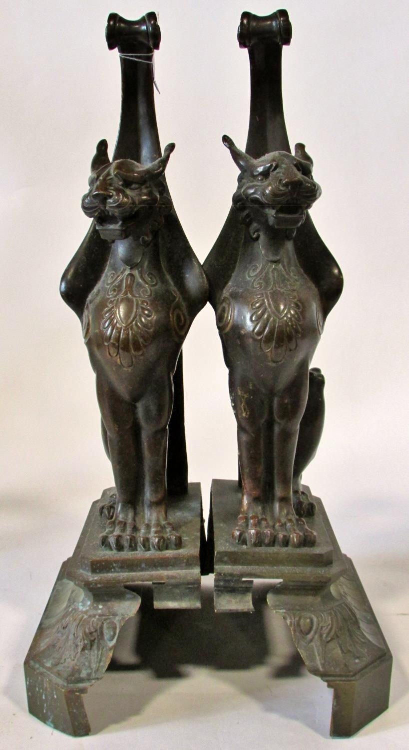 A substantial pair of 19th century cast bronze gryphons, seated in profile, raised on stepped - Image 5 of 6