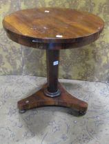 A small 19th century rosewood veneered occasional table of circular form raised on an octagonal