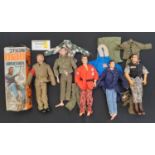 A large collection of Action Man figures and accessories including a box for Action Man Adventurer