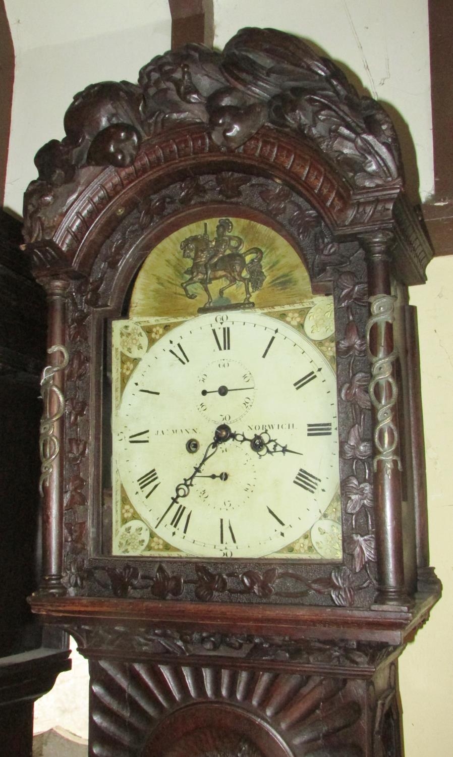 A 19th century oak longcase clock with heavy estate carving, the trunk detailing a knight fighting - Image 17 of 17