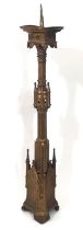 A tall and impressive 19th century gothic ecclesiastical brass pricket candlestick, of Puginesque
