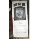 An early Edwardian pine framed front door with original leaded light art nouveau style panel and