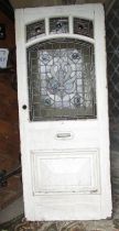 An early Edwardian pine framed front door with original leaded light art nouveau style panel and