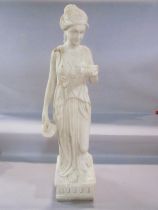 A Marble statue of a Classical Maiden wearing a toga carrying a ewer and bowl, raised on a square