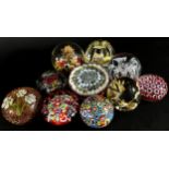 A collection of 19, 20th century, glass paperweights of varying designs, millefiori, dried