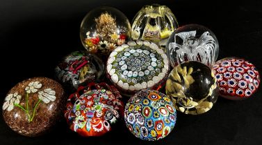 A collection of 19, 20th century, glass paperweights of varying designs, millefiori, dried