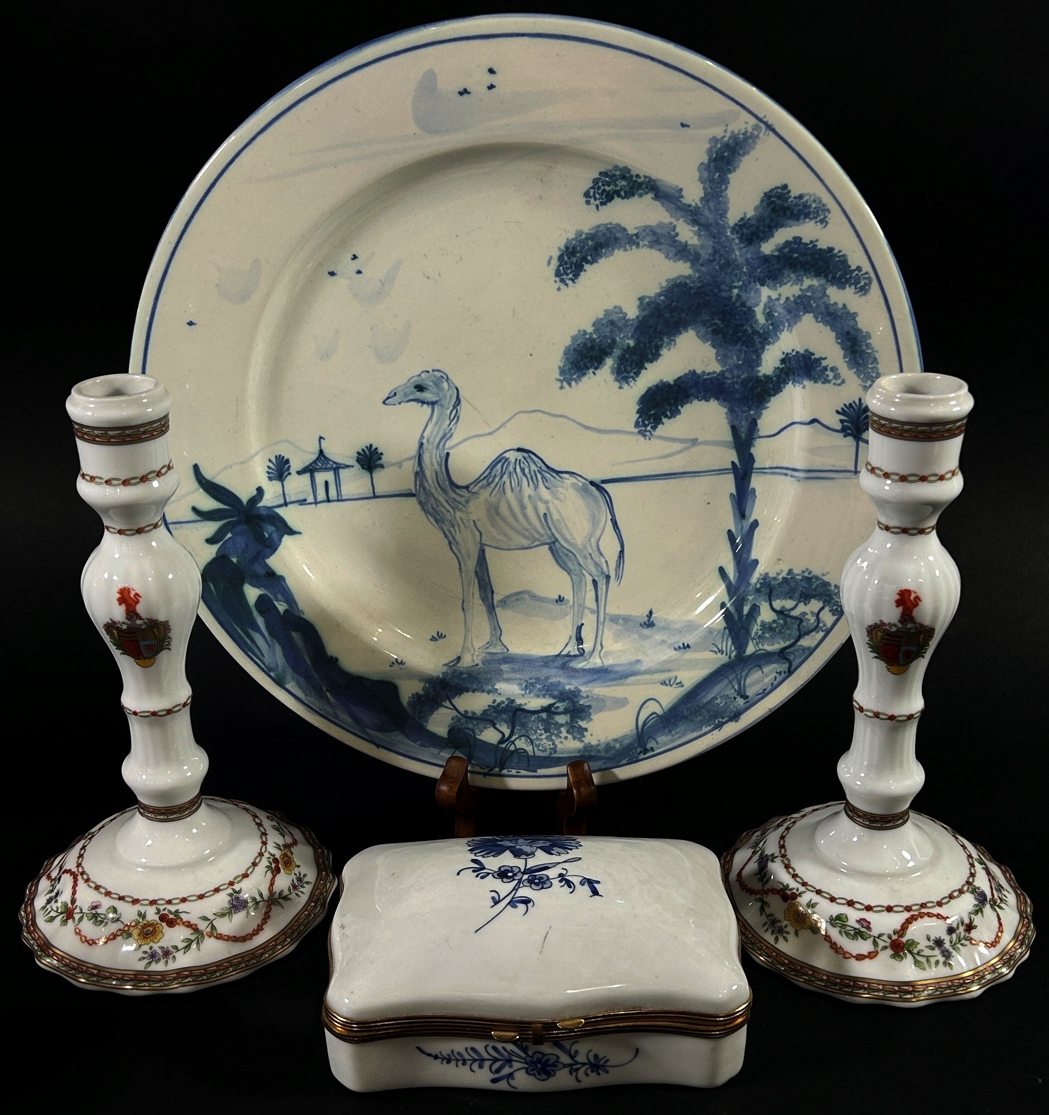 A hand-painted blue and white plate showing a camel in landscape for Coalfax and Fowler, a pair of