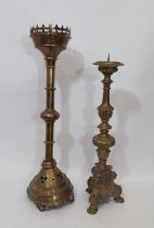 A tall 19th century ecclesiastical brass pricket candlestick (AF) 73cm high, together with another