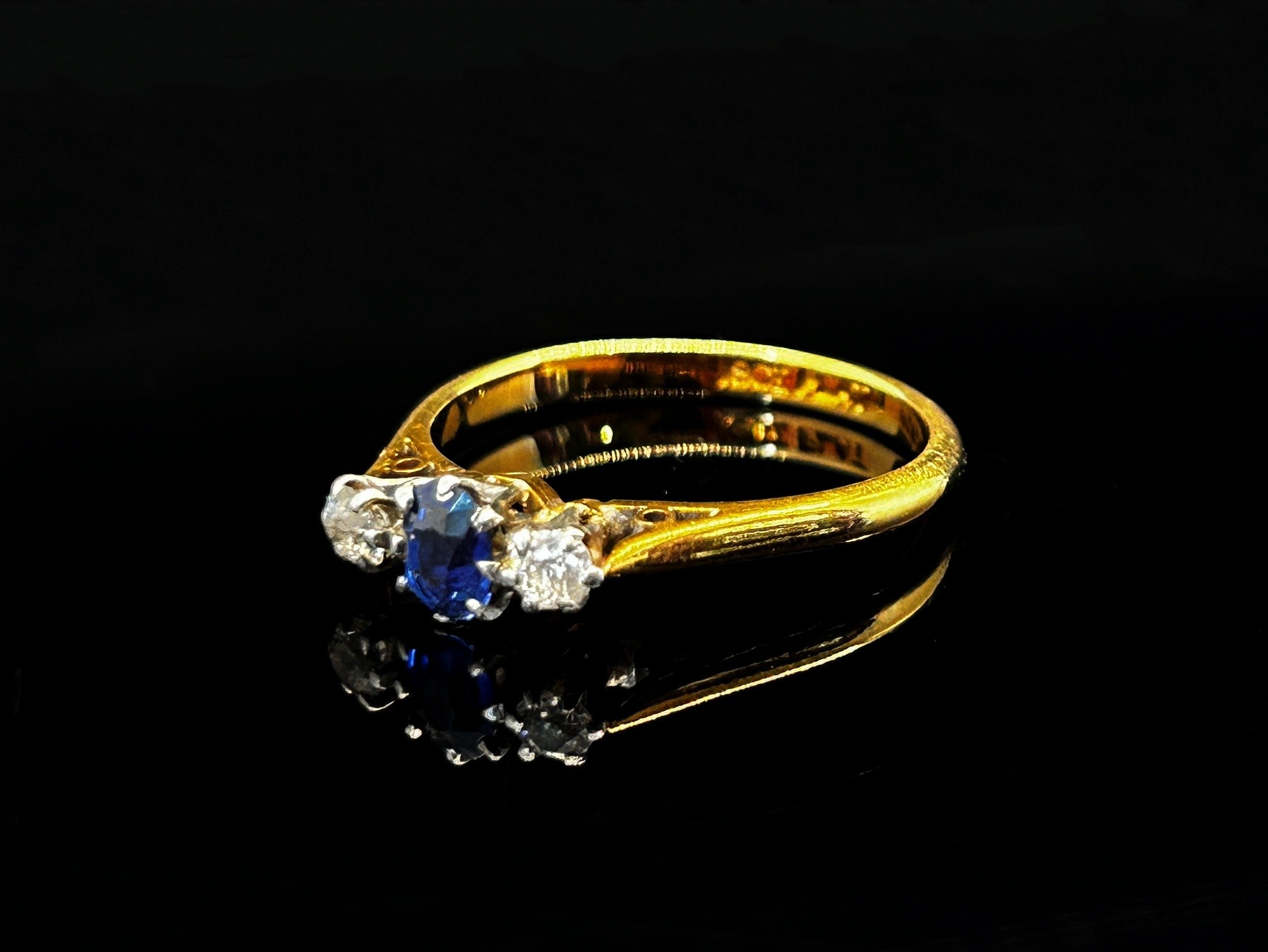 Early 20th century 18ct claw set sapphire and diamond three stone ring with platinum setting, size