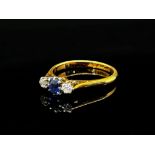 Early 20th century 18ct claw set sapphire and diamond three stone ring with platinum setting, size