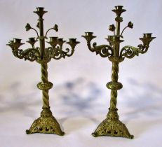 A pair of 19th century seven light gilt brass ecclesiastical candelabra, with scrolling branches and