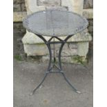 A cafe table with pierced top on swept tripod base, 52cm diameter