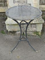 A cafe table with pierced top on swept tripod base, 52cm diameter