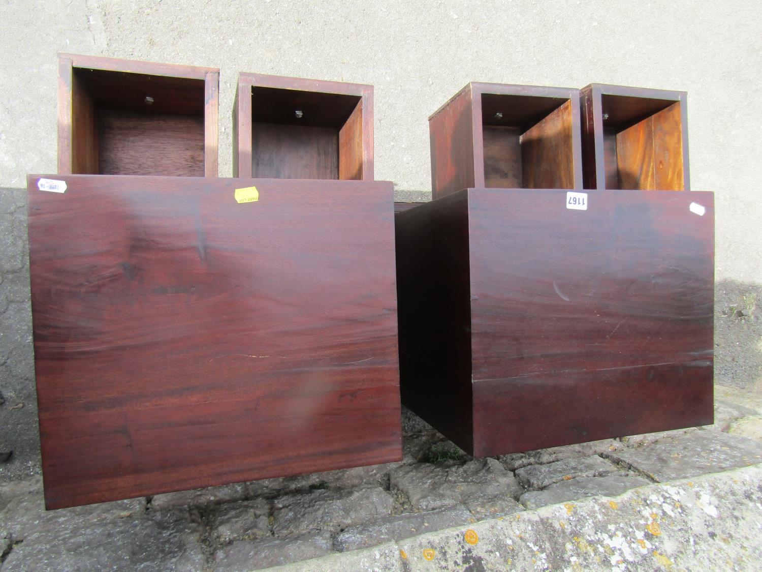 A pair of contemporary hardwood chests each enclosing four drawers, on shaped supports, 46cm wide