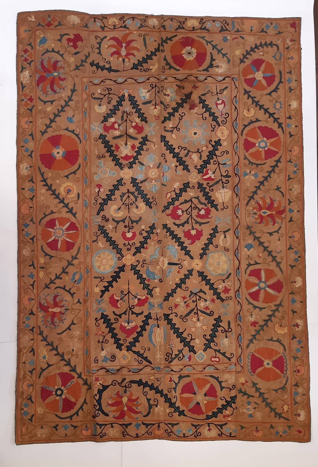 19th century Uzbek Suzani panel created from 4 sections embroidered in silk chain stitch on dark