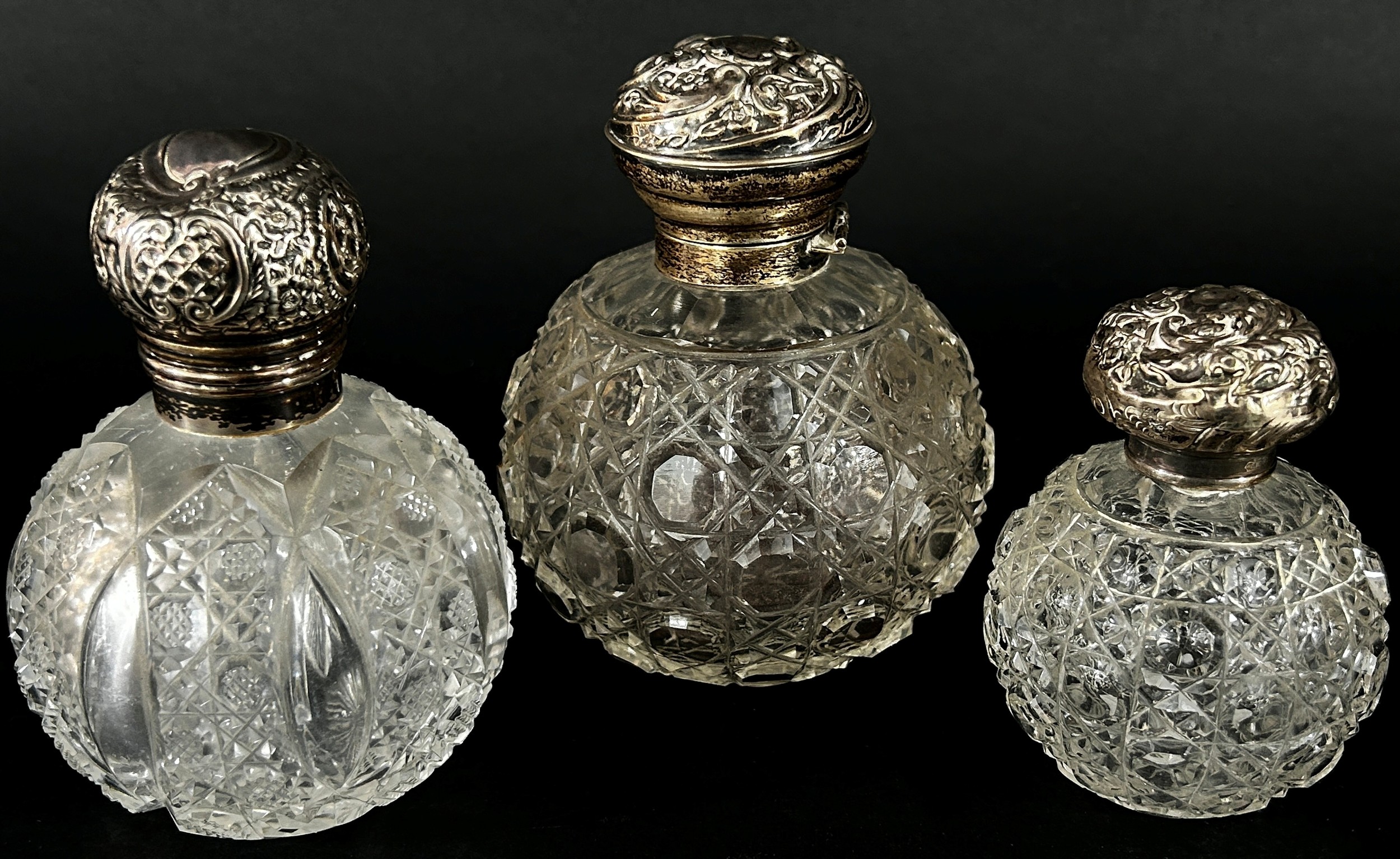 Three 19th century cut glass perfume bottles all with silver caps - Image 2 of 3