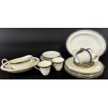 A collection of Minton Consort tea and dinner ware for six with repeating blue and gilt detail