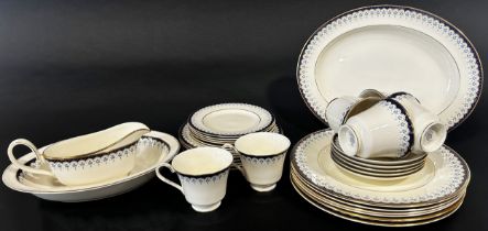 A collection of Minton Consort tea and dinner ware for six with repeating blue and gilt detail