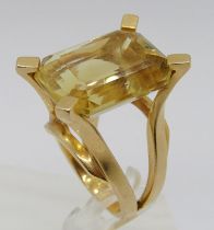 Impressive vintage yellow metal citrine cocktail ring with raised setting, in the style of Dinh