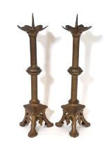 A pair of 19th century continental ecclesiastical brass picket candlesticks, with flared cradles,