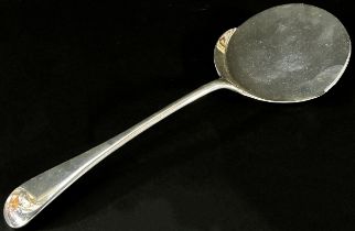A silver tomato serving spoon with a flat round bowl, Sheffield 1911, Harrison Brothers & Howson,