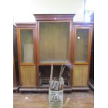 19th century mahogany breakfront three sectional cupboard with geometric brass grilled doors, fitted