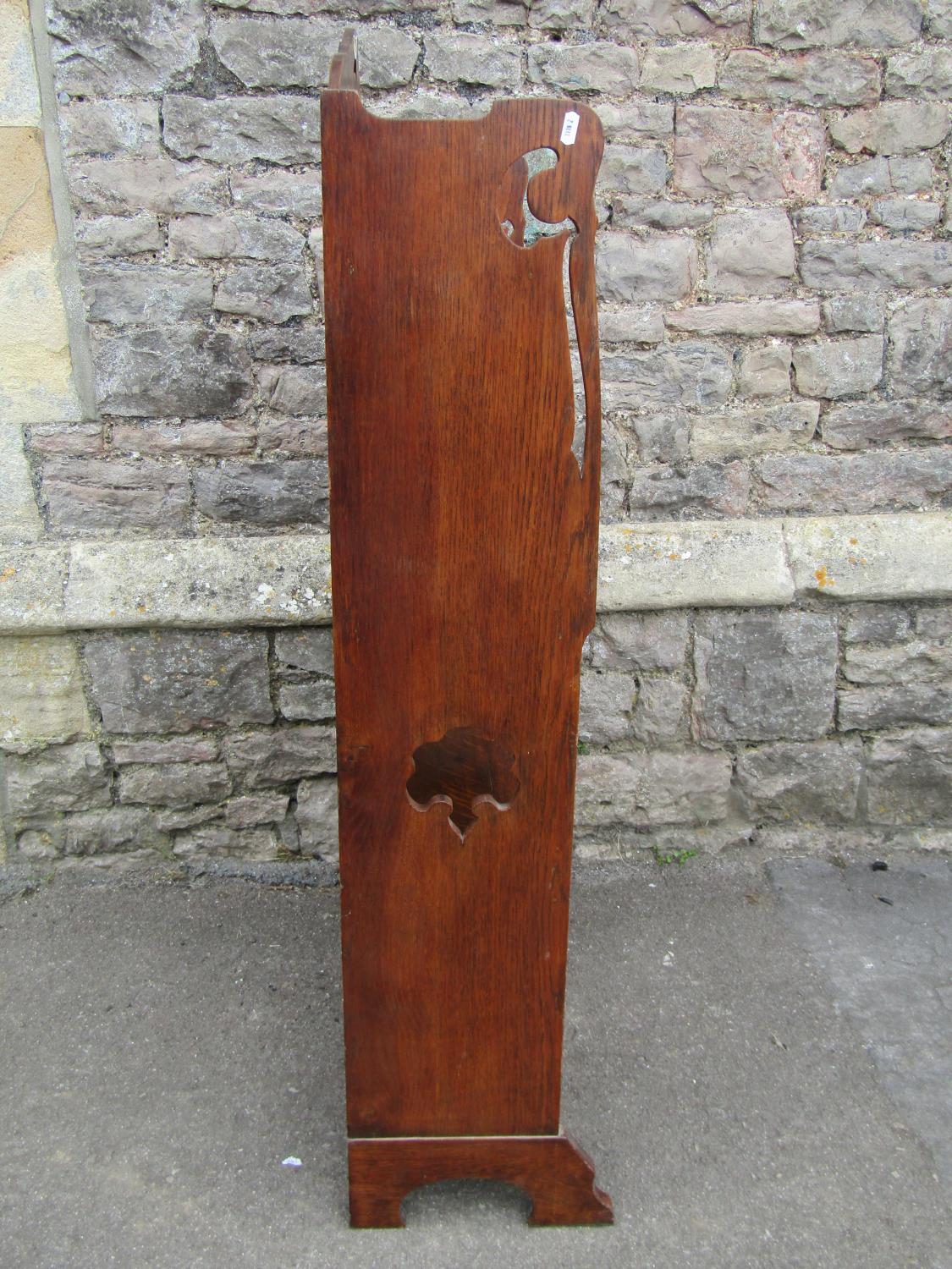 An early 20th century oak students bureau with strap hinges, the raised back with pierced detail - Image 3 of 5