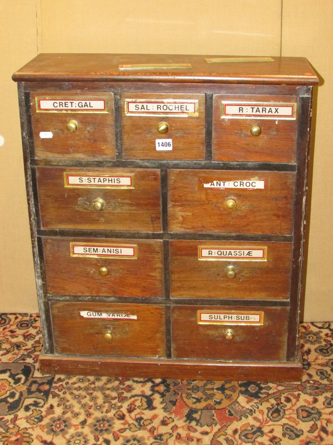 A small apothecary cabinet of nine drawers, 58cm wide x 68cm high x 21cm deep