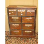 A small apothecary cabinet of nine drawers, 58cm wide x 68cm high x 21cm deep