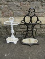 Two cast iron stick stands both with decorative finish