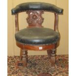A 19th century mahogany library chair with carved splat, horseshoe shaped back and circular seat
