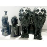 A decorative group of 19th century and later carvings to include a large pair pf recumbent lions,