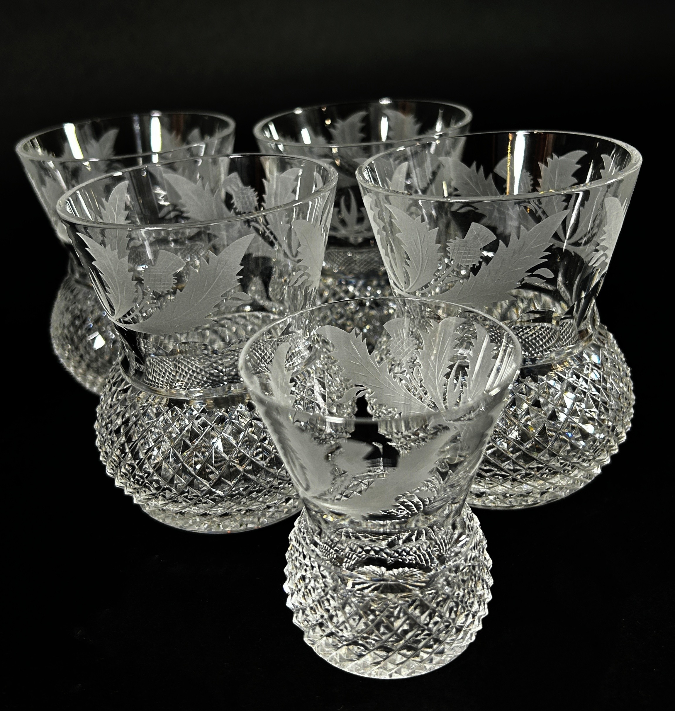 Four Edinburgh Crystal Thistle Whisky Glasses, a single shot glass and two brandy balloons to match,