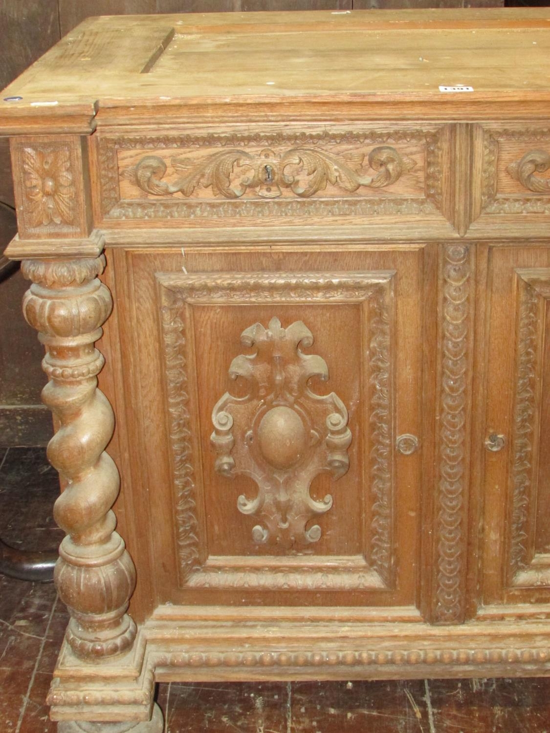 A 19th century oak side cupboard enclosed by two carved and panelled doors with two frieze drawers - Image 3 of 4