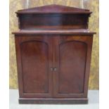Mid 19th century mahogany veneer chiffonier enclosed by two panelled doors beneath a raised back,