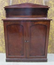 Mid 19th century mahogany veneer chiffonier enclosed by two panelled doors beneath a raised back,