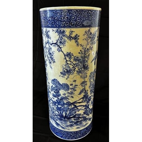 A Japanese blue and white porcelain stick stand (A/F) 62 cm high x 25.5 cm diameter
