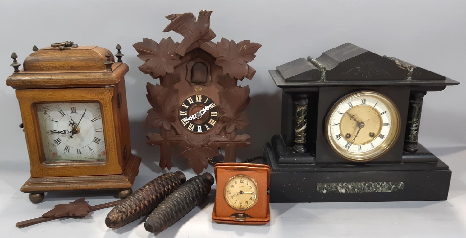 A small reproduction German cuckoo wall clock, together with a small polished slate and marble