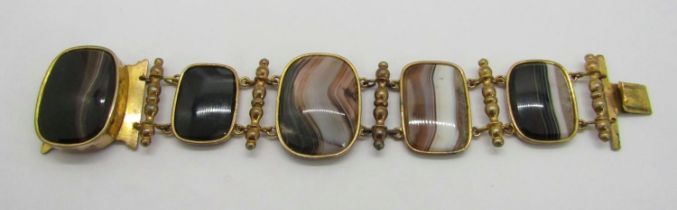 19th century gilt metal and polished agate bracelet, set with five graduated banded agate panels
