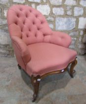 A Victorian drawing room chair with buttoned frame on cabriole legs