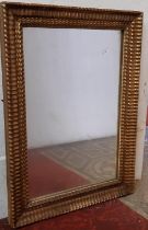 A 19th century wall mirror with repeating geometric frame and original gilded finish, 72cm x 53cm