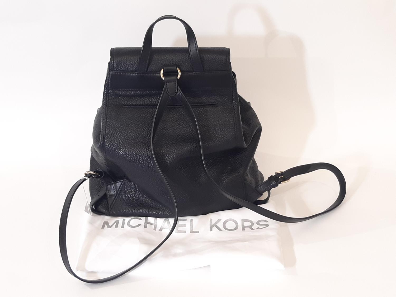 Ladies backpack style bag by Michael Kors in textured black leather with top flap, 2 front pockets - Image 2 of 3